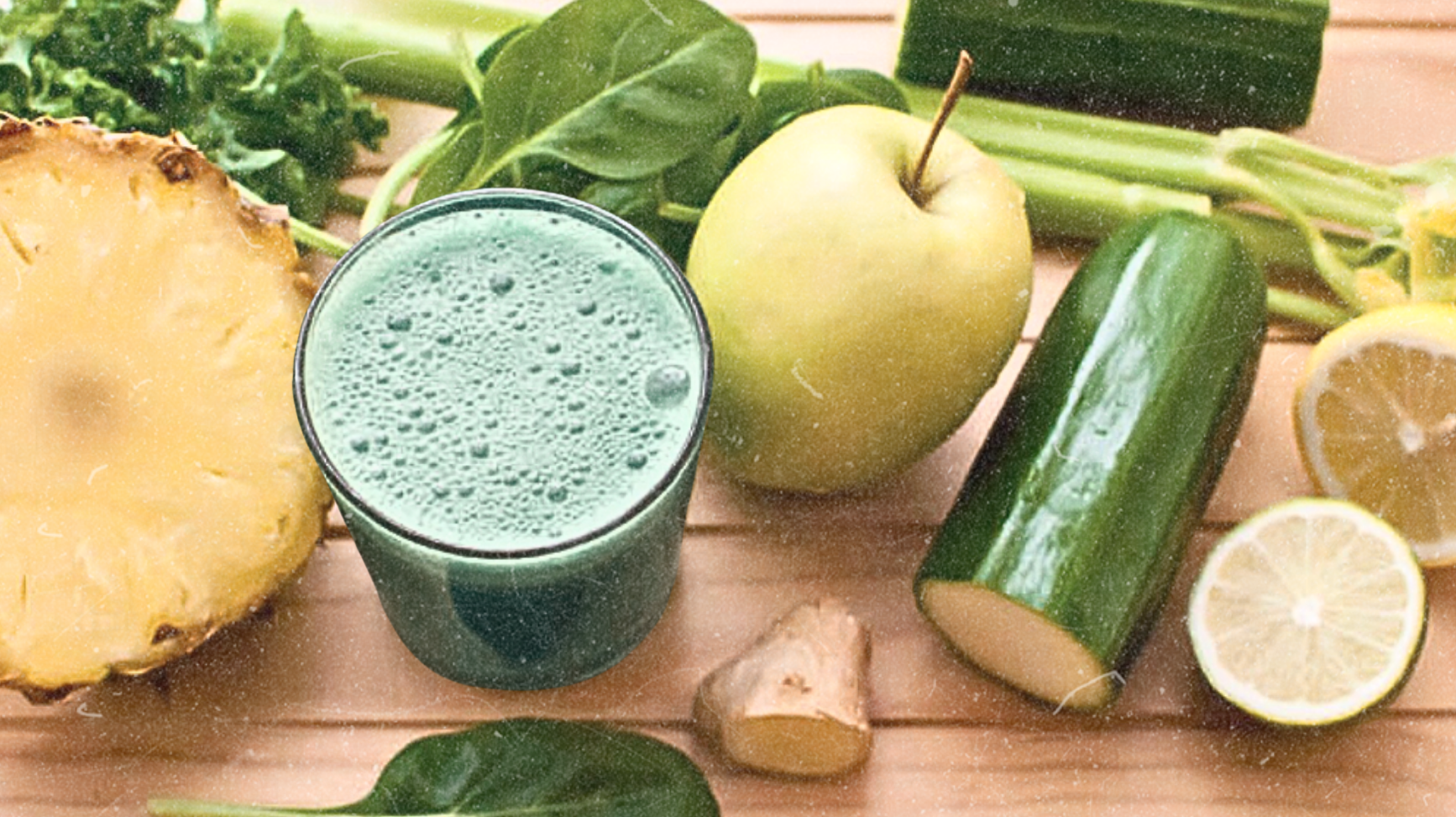 Green Glow Detox Smoothie with pineapple, cucumber, green apple, lemon, and leafy greens blended with Elyxar for energy, digestion, and cleansing support.