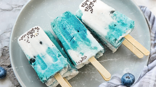 Lemon blueberry chia popsicles swirled with Elyxar Daily Superfood Complex for a refreshing, antioxidant-rich frozen treat that supports gut health and energy.